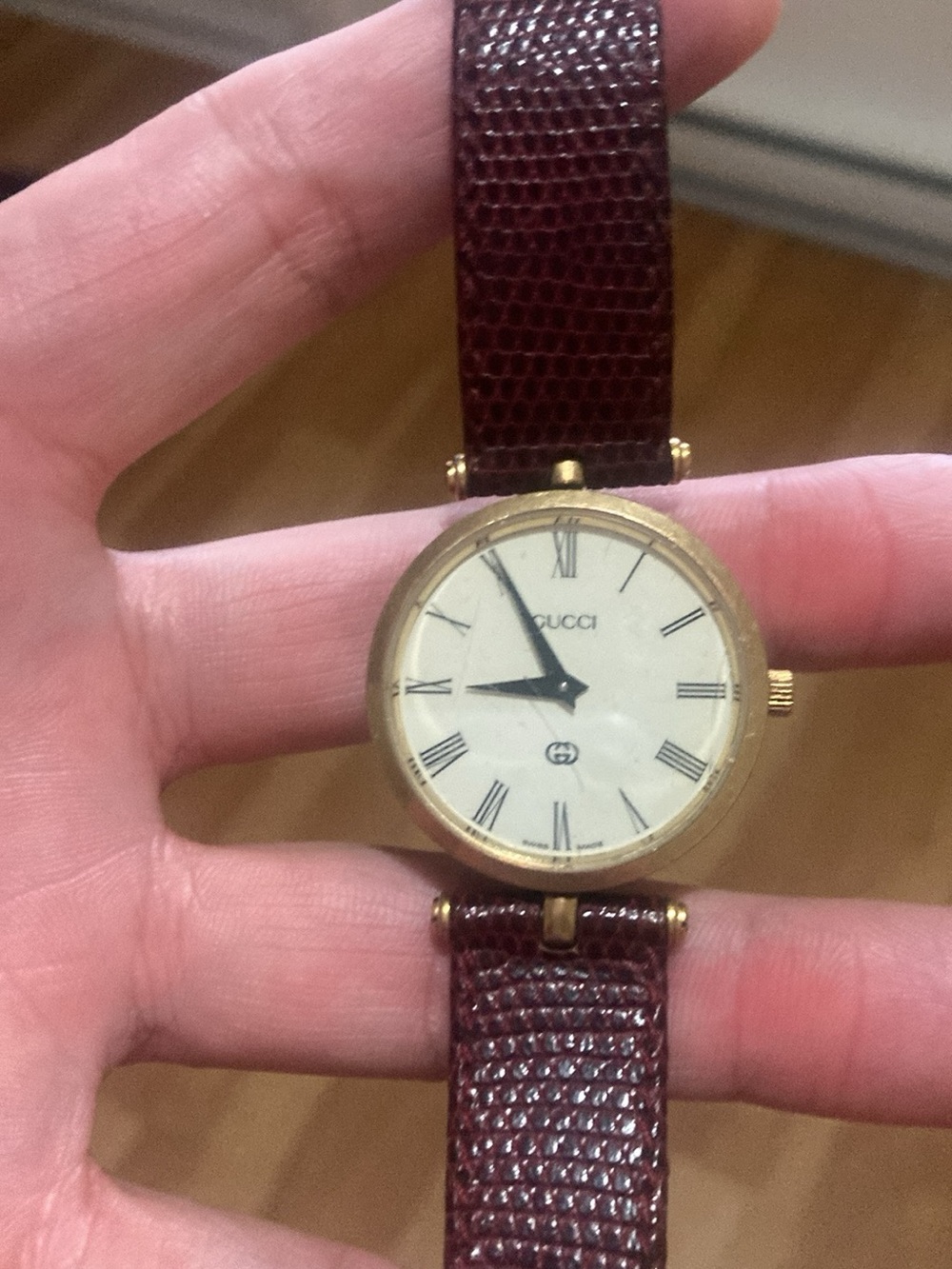 Vintage Gucci Gold Tone Round Watch with Burgundy Leather Strap